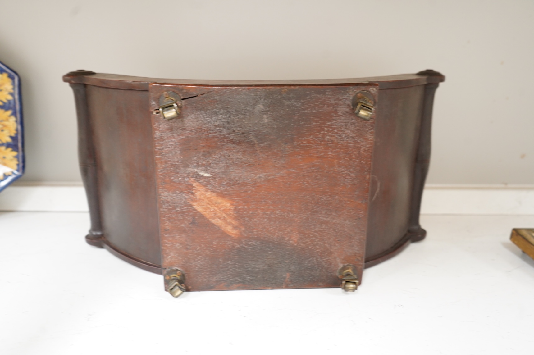 A George III mahogany cheese coaster, with original brass castors, 43cm wide